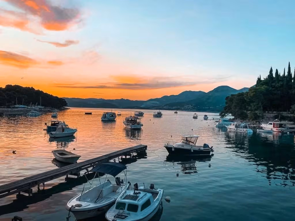 Cavtat's tranquil summer evening, capturing the stunning sunset views over the Adriatic Sea.