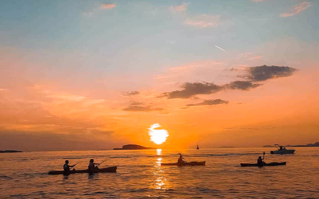 Sea kayaks near Dubrovnik Old Town with Lokrum Island in the distance.