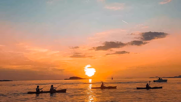 Sea kayaks near Dubrovnik Old Town with Lokrum Island in the distance.