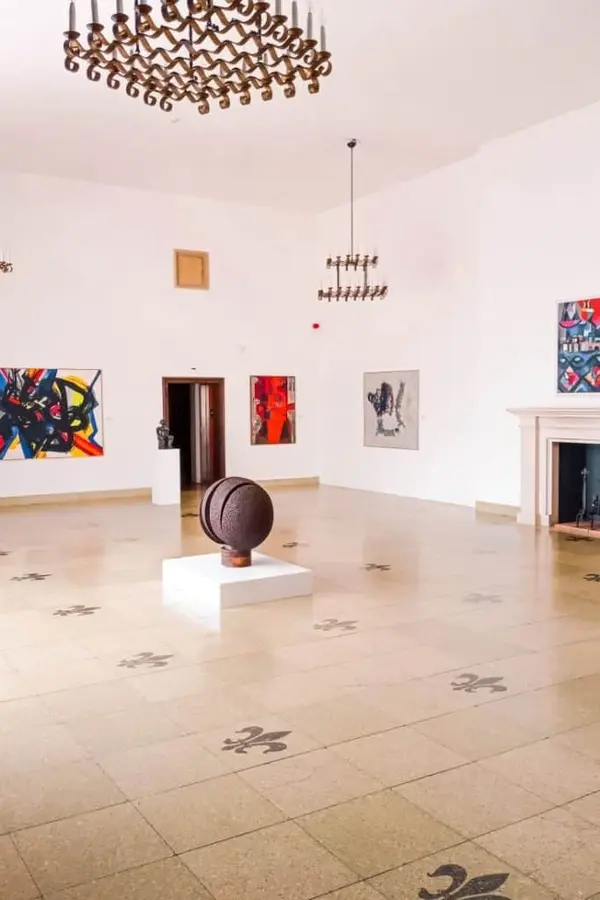 Contemporary sculptures and paintings in the museum gallery.