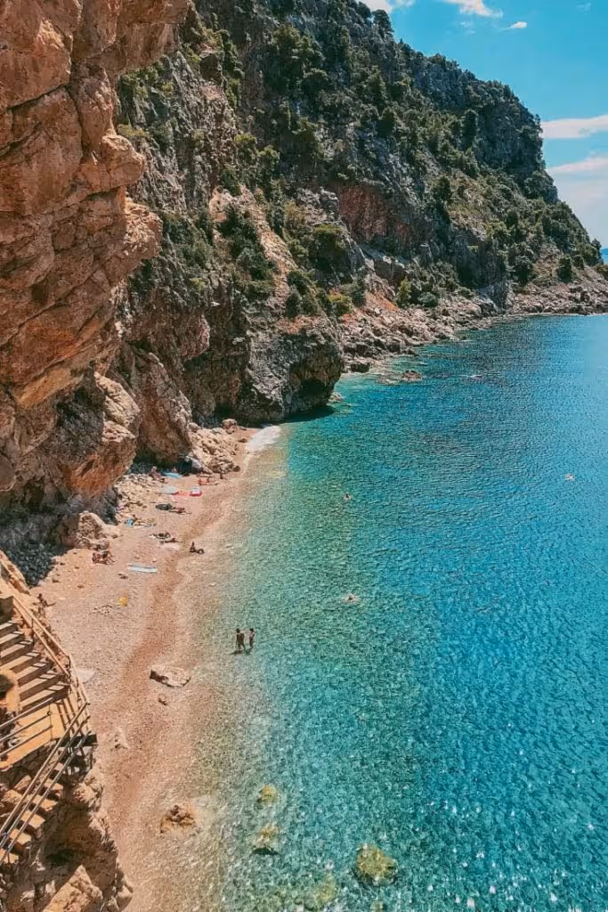 Trail leading down cliffs to Pasjača Beach near Cavtat