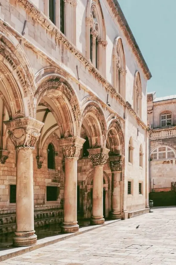 Ornamented arches and pillars of the Rector's Palace portico from Stradun.