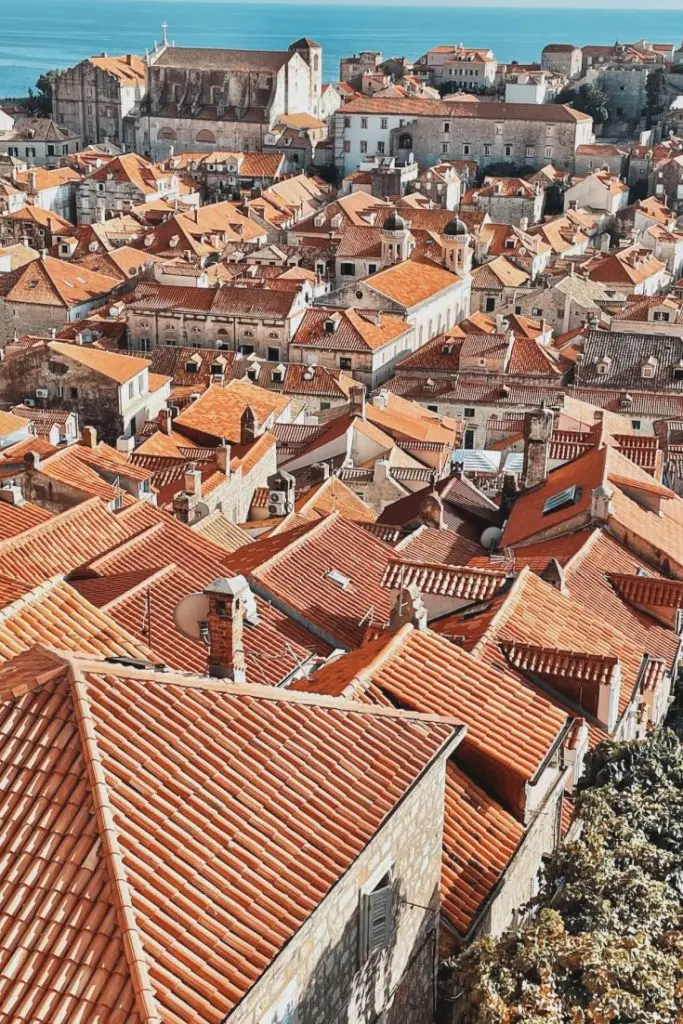 Red-tiled rooftops of Dubrovnik Old Town seen from the City Walls.