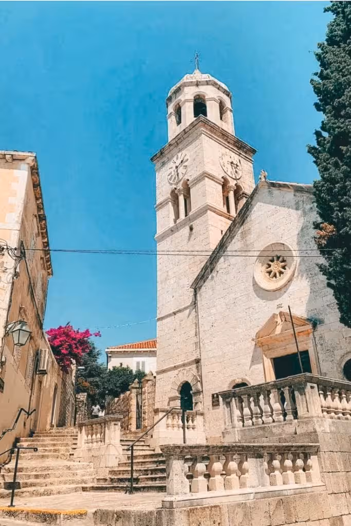 St Nicholas Church Cavtat with bell tower by harbor