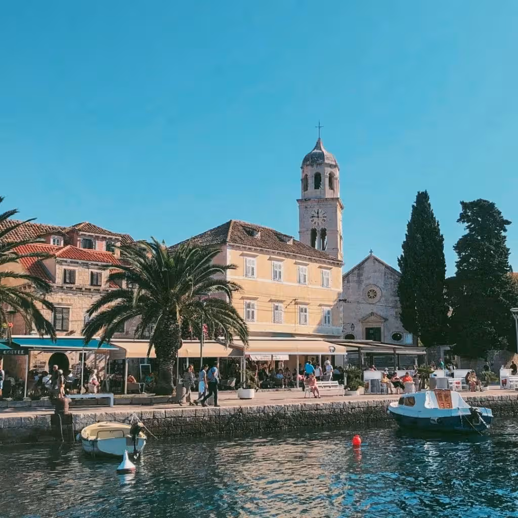 visitors walking along Cavtat seafront promenade by Adriatic sea