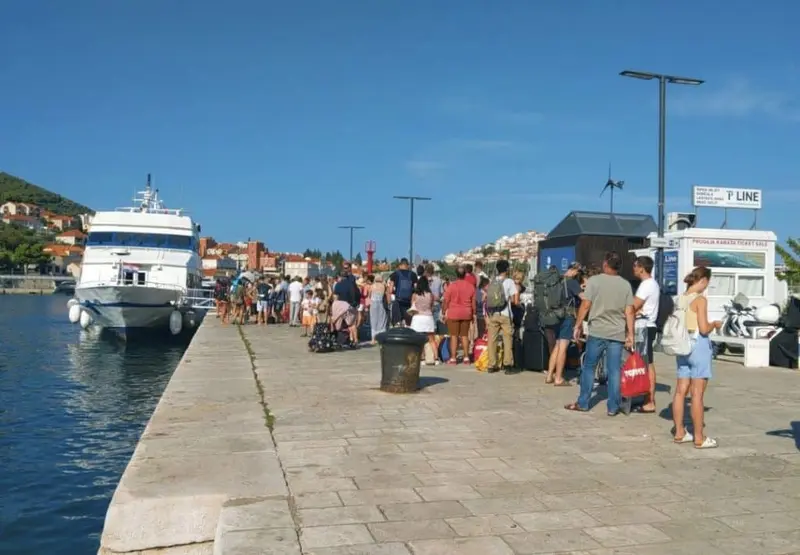 Crowd in a long line waiting to board the Elafiti ferry.