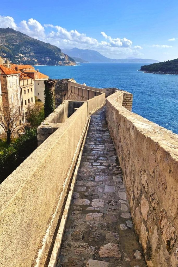 PNarrow stone walkway on Dubrovnik City Walls near Bastion Holy Marguerite