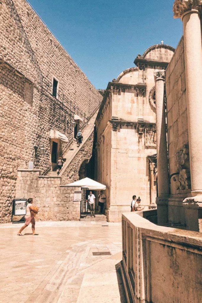 Pile Gate City Walls entrance beside the Church of St. Saviour with ticket booth and staircase.