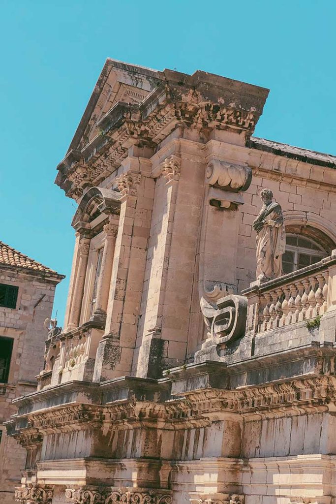 Detail of Baroque stone statues and ornaments on Dubrovnik Cathedral.